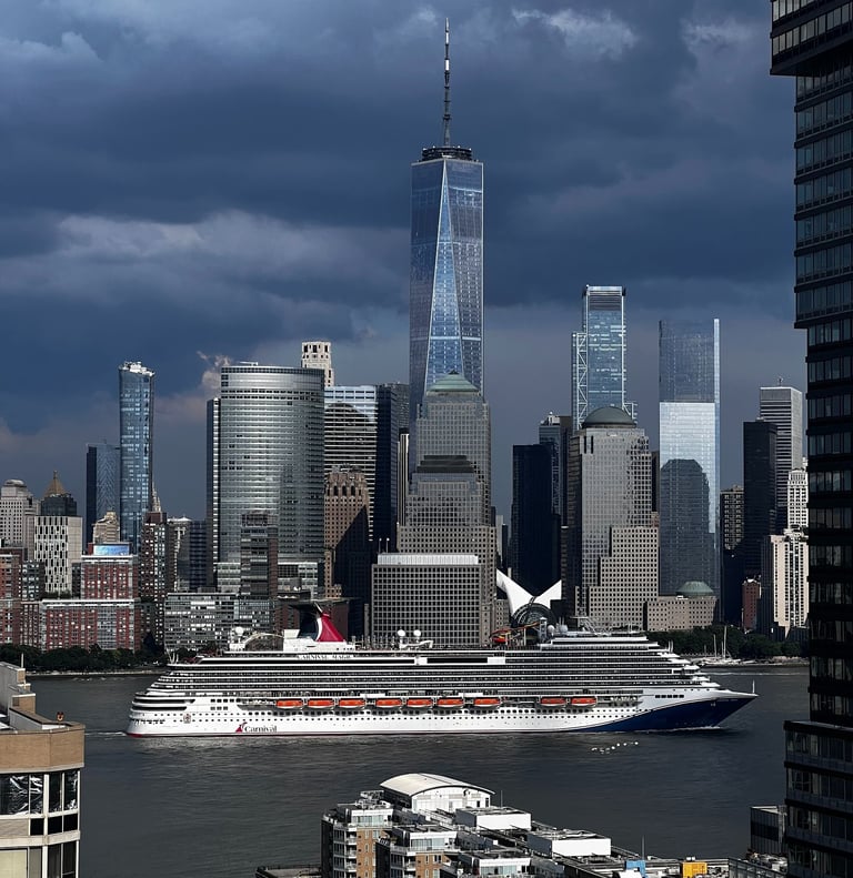 a cruise ship in the water near a city