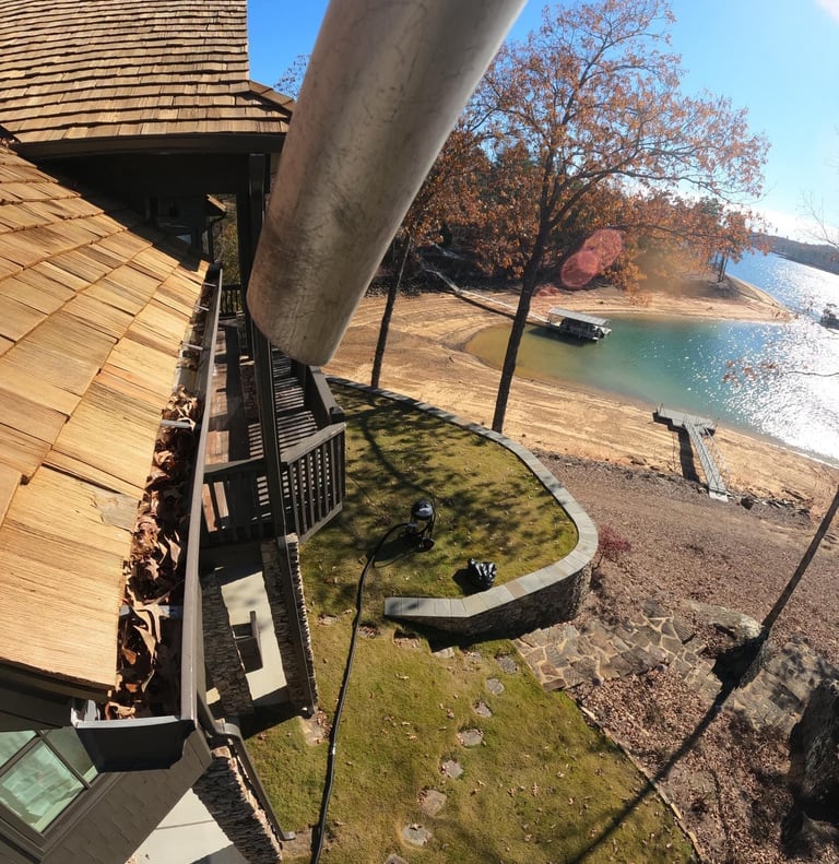 Leaves in gutters at Smith Lake house