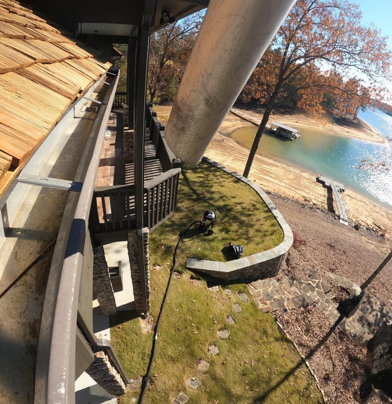 Clean gutters at Smith Lake house