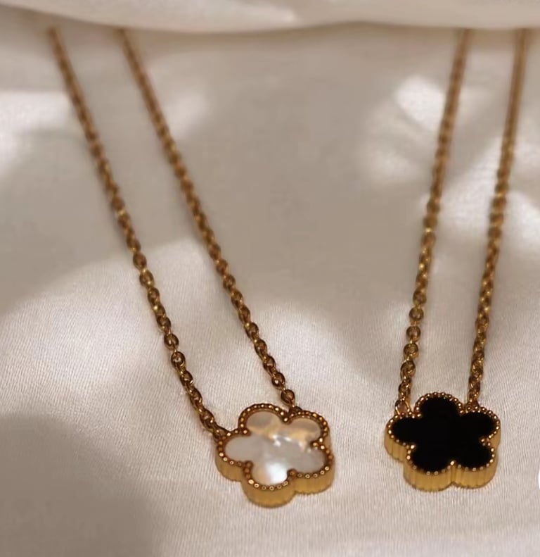 Clover necklaces in different colours. 