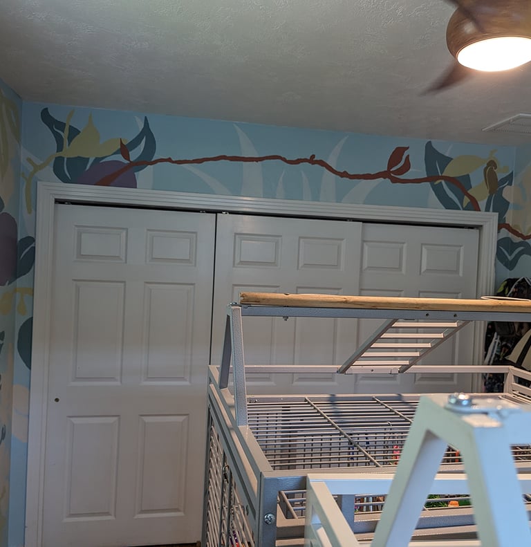 Using bright contrasting color shapes for a bright stylist interior wall mural with closet doors.