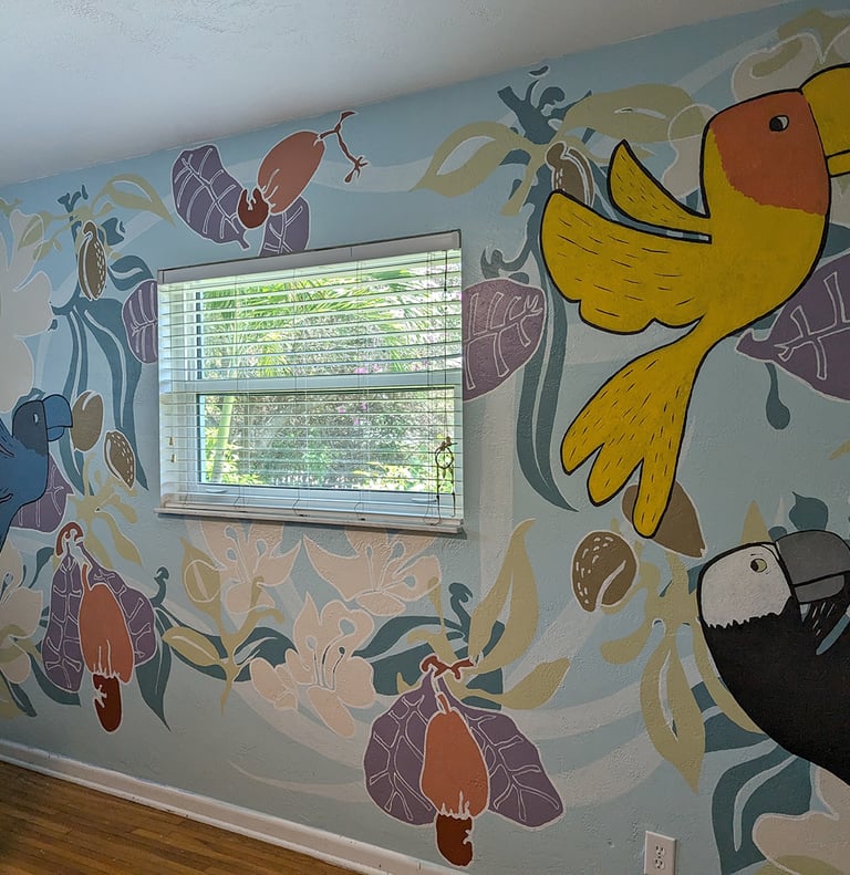 Colorful parrot mural with flowers and foliage in a bedroom mural.