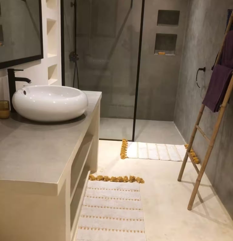a bathroom with a sink and a ladder