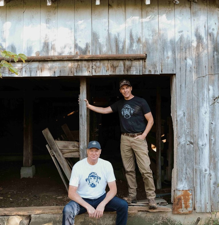 two men in opening of old barn