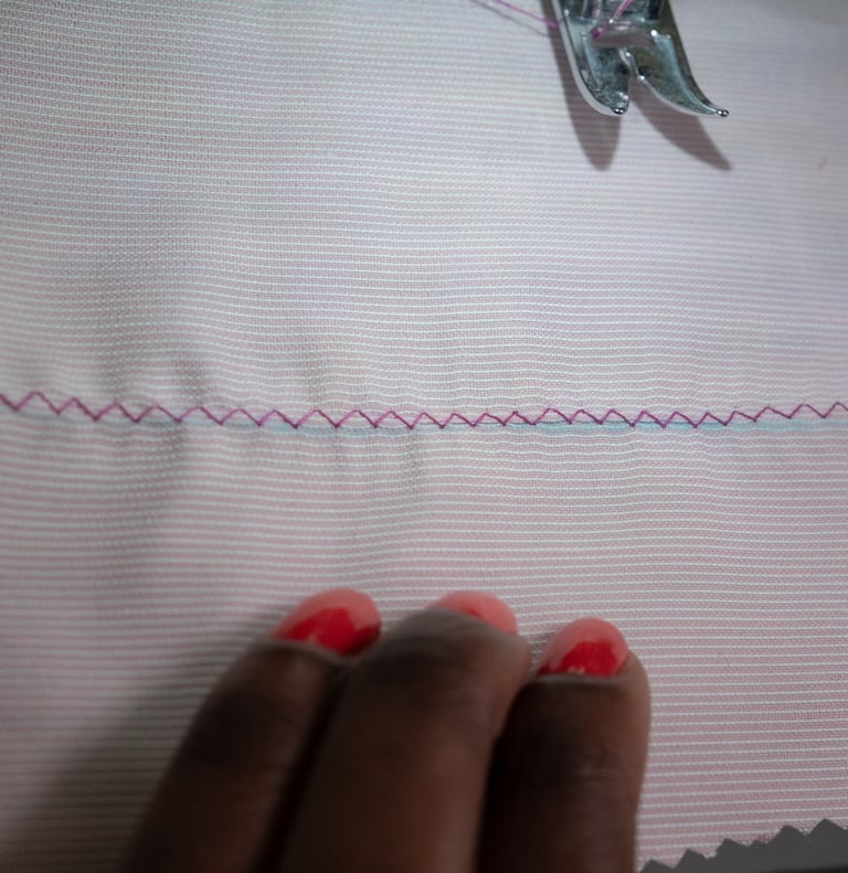 Zig zag stitches shown on pink fabric