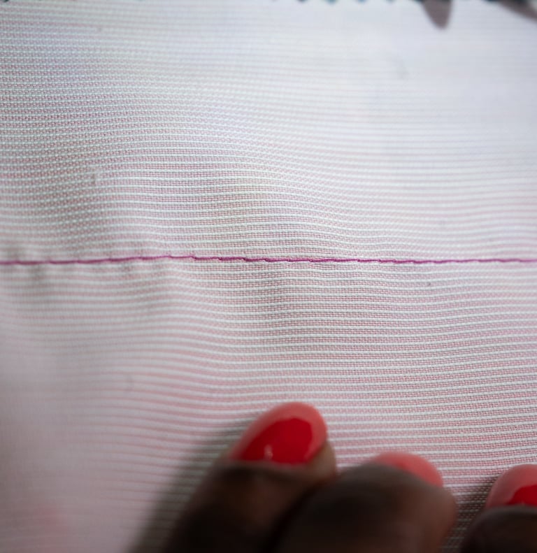 Basting stitch on pink fabric
