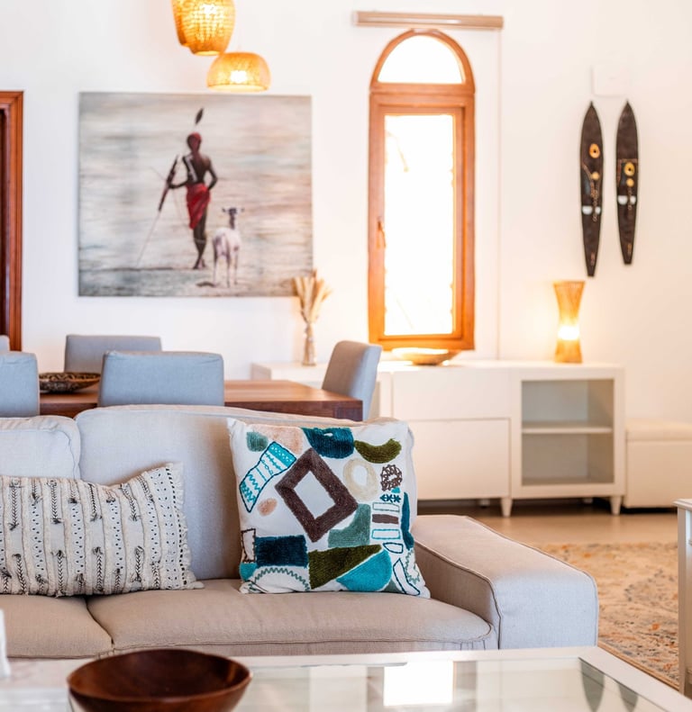 a living room with a couch and a table at Villa Serene in Zanzibar