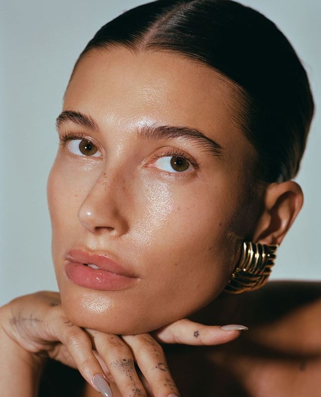 Hailey Bieber a woman with a tattoo on her hand