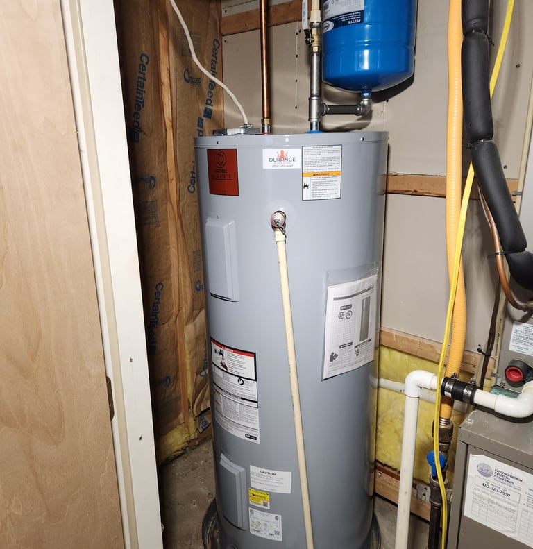 Newly installed electric water heater with safety valve in Rockville, MD residence