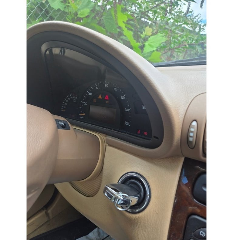 Car key in ignition of a 2003 Mercedes - car locksmith service