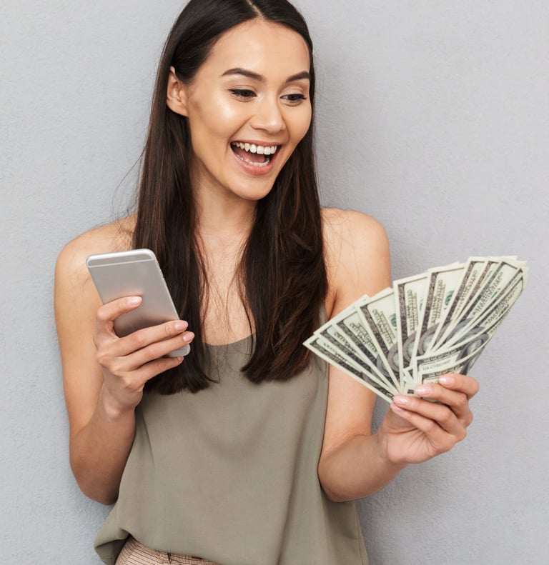 a woman holding a cell phone and holding a cell phone