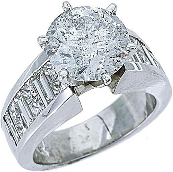 Elegant round cut diamond engagement ring in white gold with side baguette stones.
