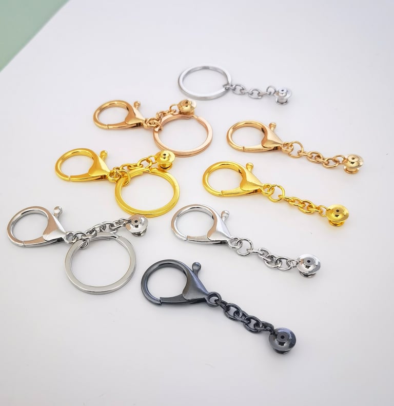 Enamel Pin-to-Keychain Adapters with different plating metal colors