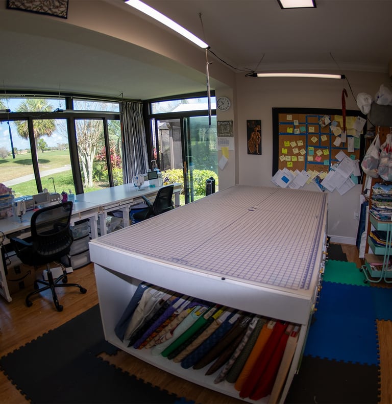 Quilting studio workspace at Stitches N Ditches.