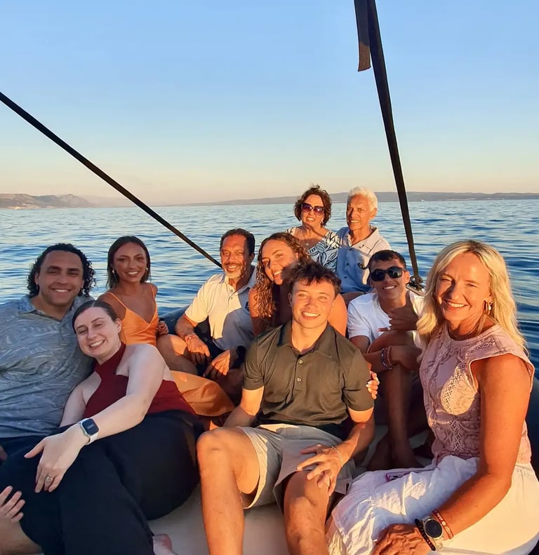 Large family posing together on a speedboat during a sunset boat tour in Split