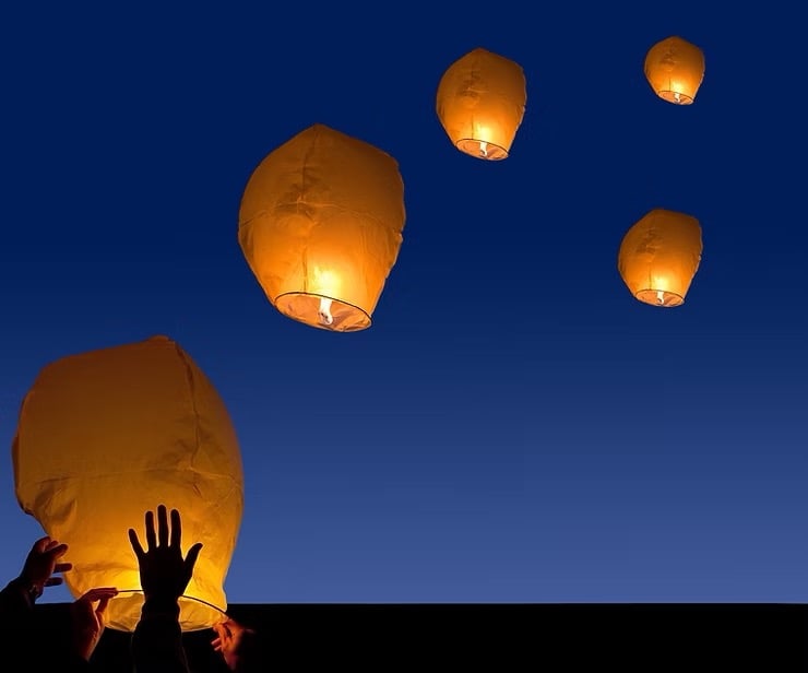Lamps floating in the sky.