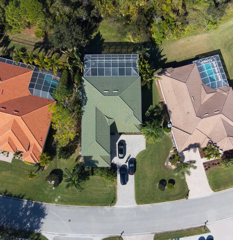Drone photo of house roof with pool
