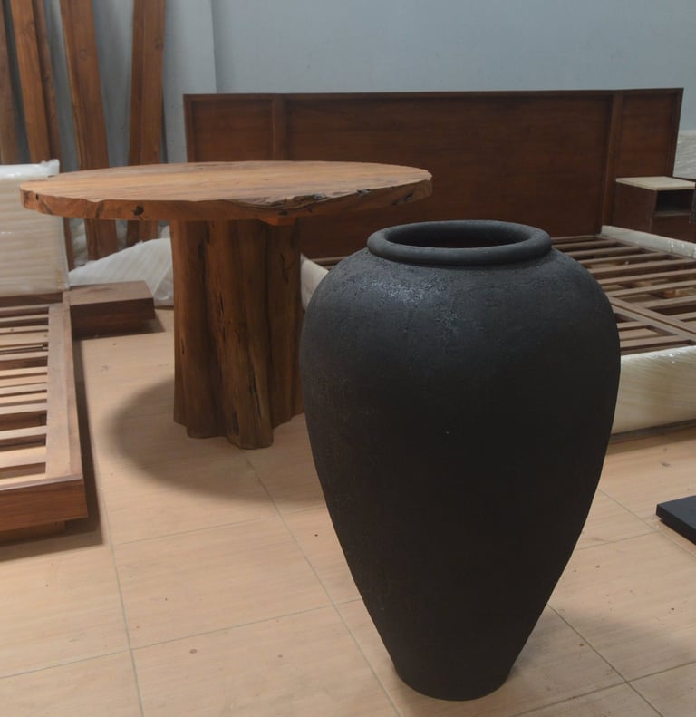 Handcrafted black terracotta vessel with volcanic texture and minimalist form, symbolizing balance b