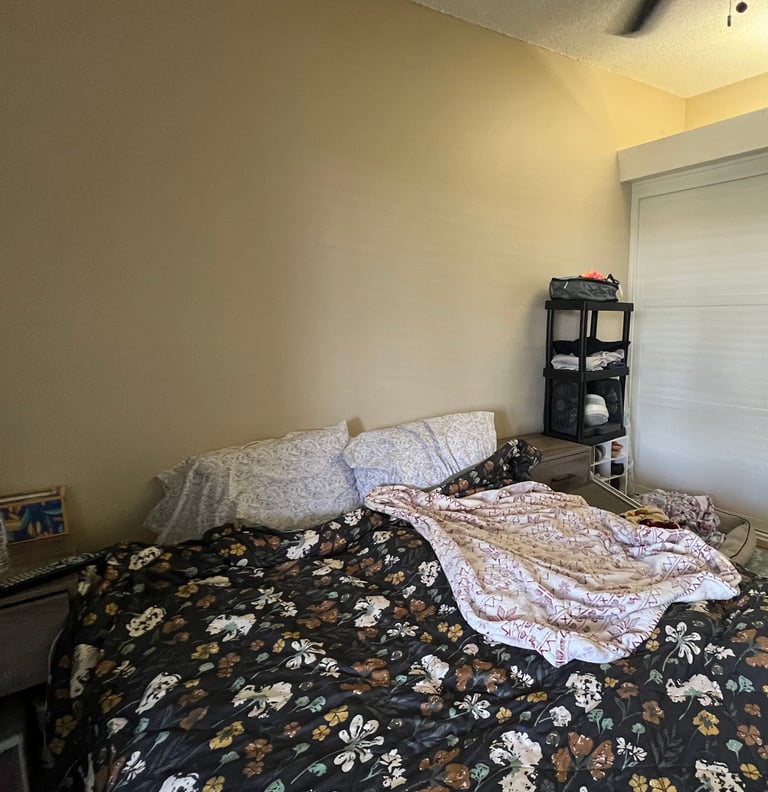 Before Staging:a bedroom with a bed and a television