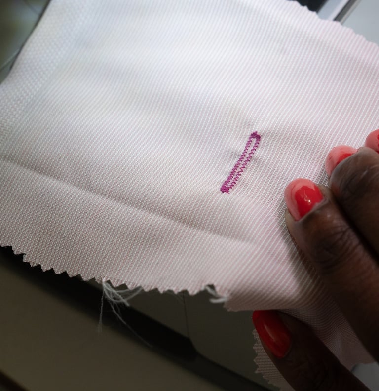 Buttonhole stitch shown on pink fabric
