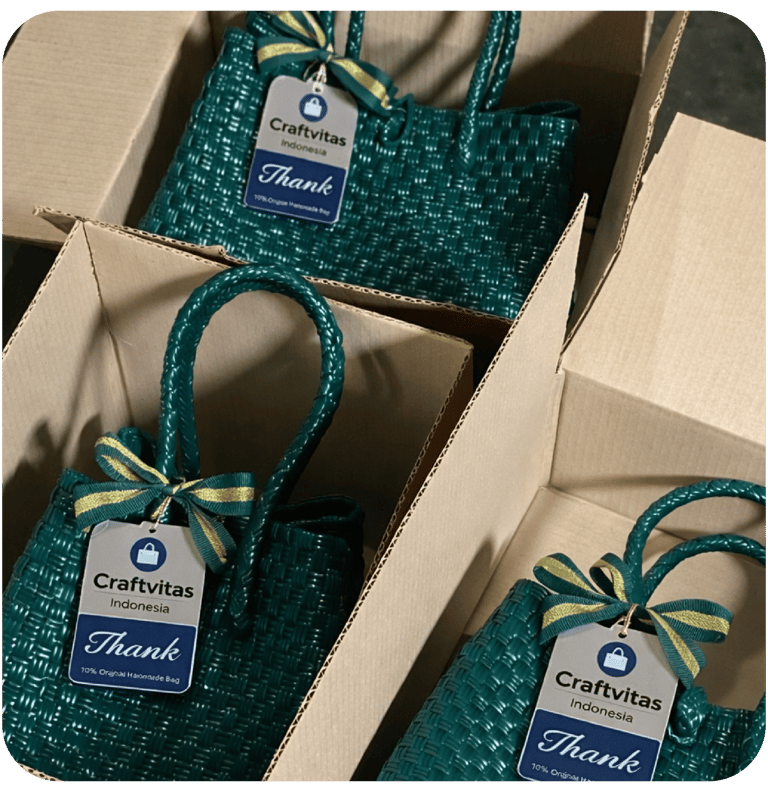 Green handmade woven plastic bag with custom Craftvitas hangtag packed in shipping box for wholesale order.