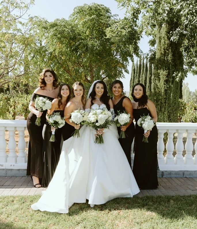 Lodi bridal party with cohesive textured hairstyles and floral hair accessories