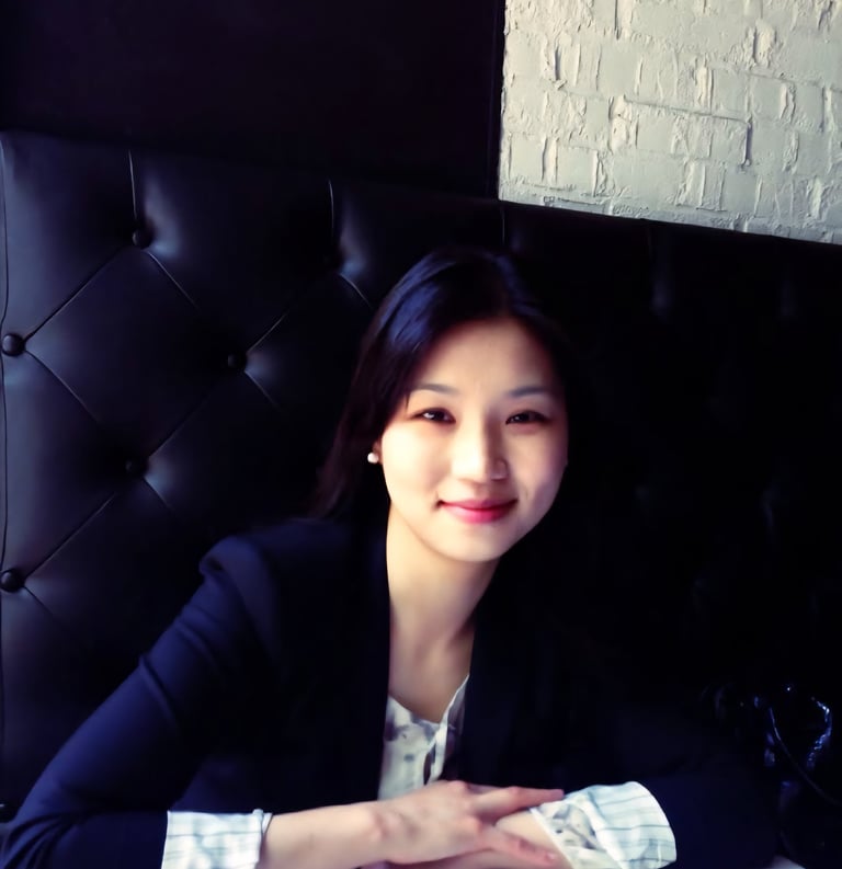 image of an asian woman smiling naturally in a professional attire