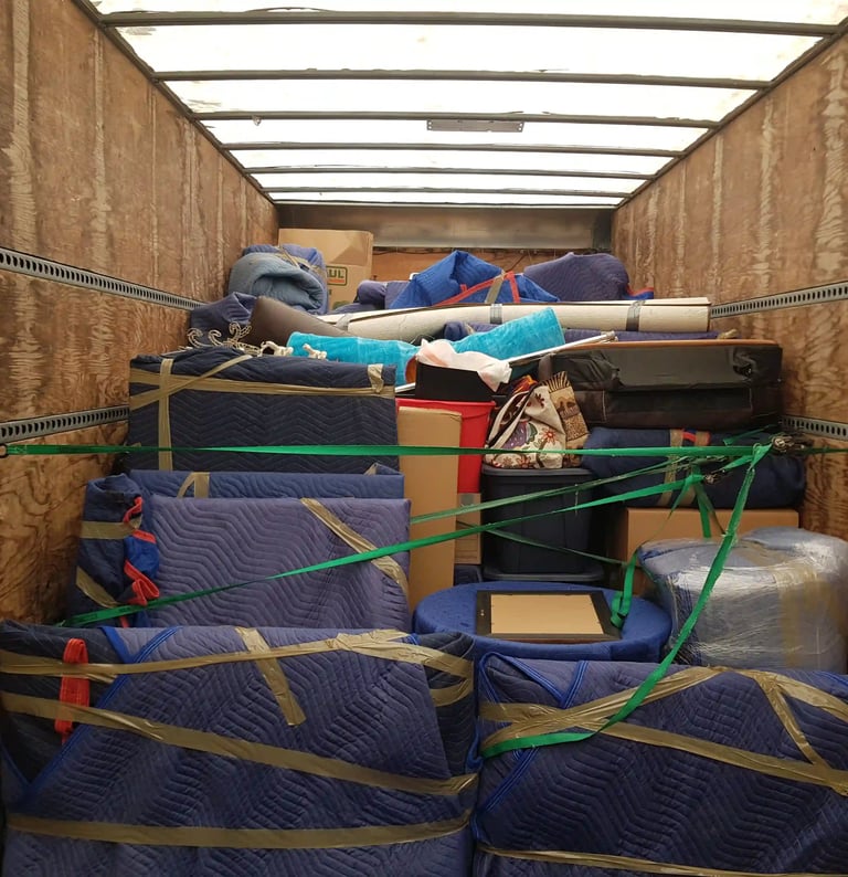 a canada's most wanted movers moving truck partially full with safely packed items.