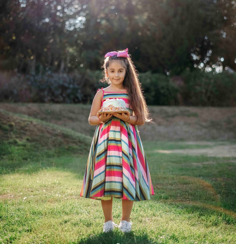 Girl in colorful striped dress posing outdoors – Fred Art Studio session