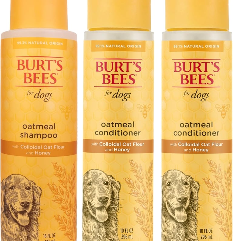 Three bottles of Burt's Bees for Dogs oatmeal shampoo and conditioner with colloidal oat flour and honey.