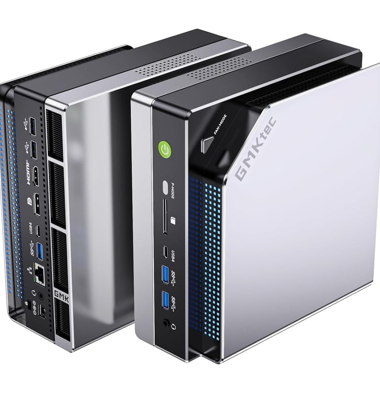 Compact GMKtec mini PC desktop computer showing front and rear ports with silver metallic finish.