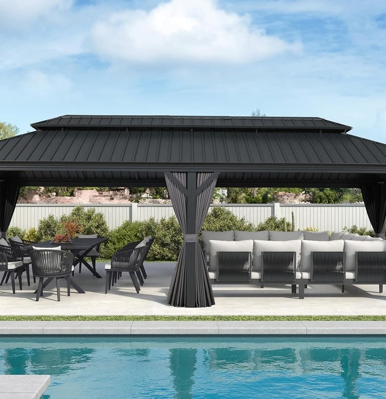 Black hardtop gazebo with outdoor dining set and sectional sofa by a backyard swimming pool.