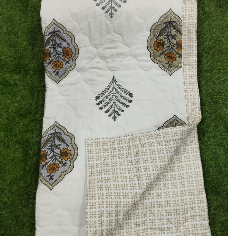 Close-up of a premium machine-quilted Jaipuri Razai winter comforter manufactured in Jaipur, Raj.