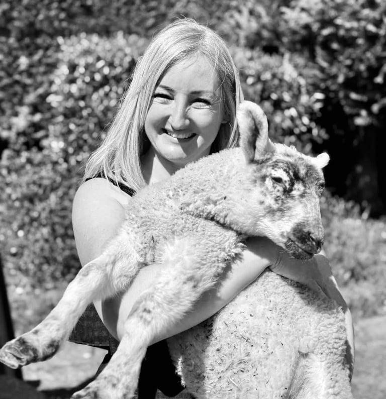 Laura holding a sheep