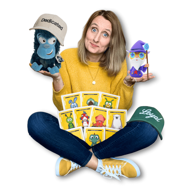 Anne Bagg holding physical Veefriends collectibles like friendscaps, plushies, trading cards, figure