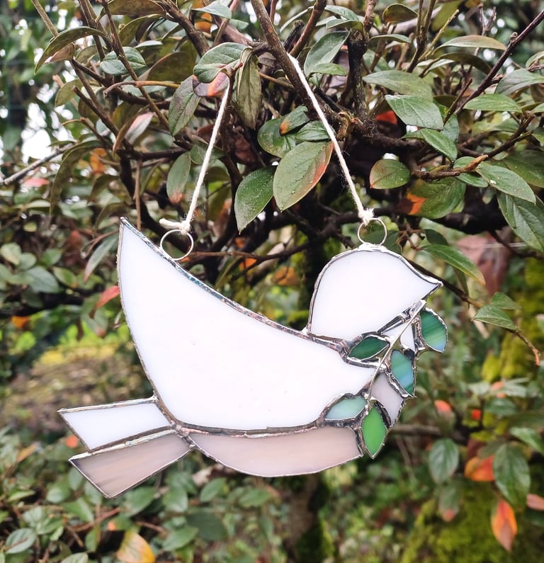 les rameaux, vitrail oiseau avec branche de rameaux