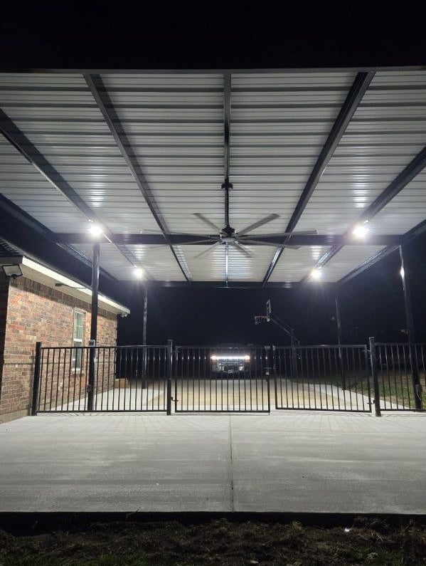 Black Fence with Fan Above