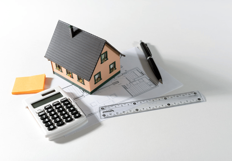 Illustration d'une maison et d’outils de mesure représentant l’activité de diagnostic immobilier