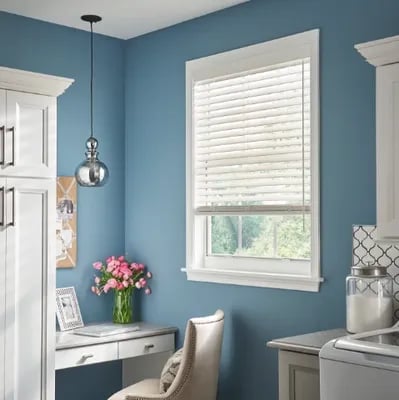 home office nook with white wood blinds and blue accent wall – Rise Up Window Coverings Milwaukee