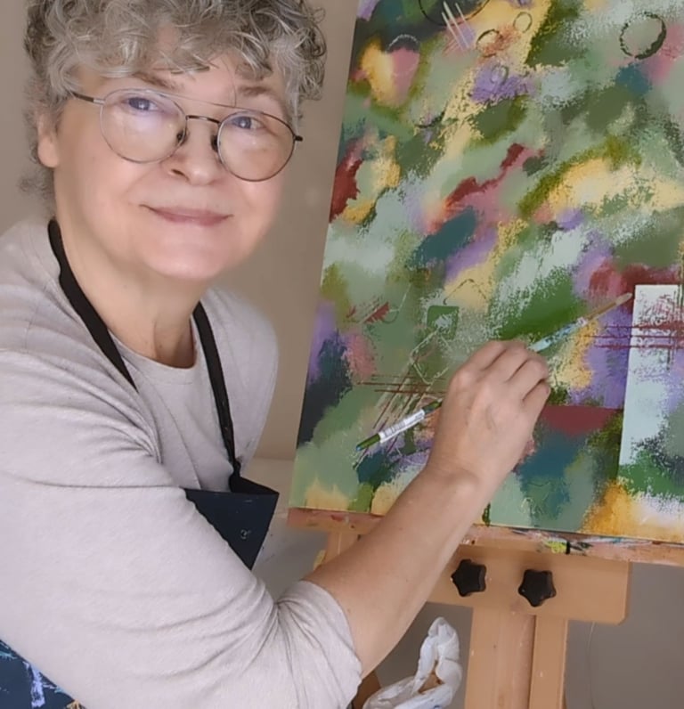 Lillian next to "leaning into greens" painting