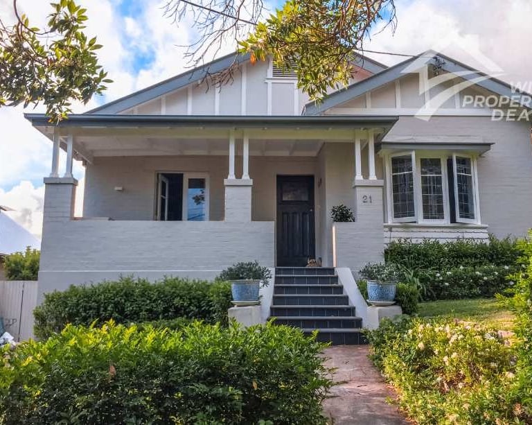 a white house with a white house with a black door and a white house with