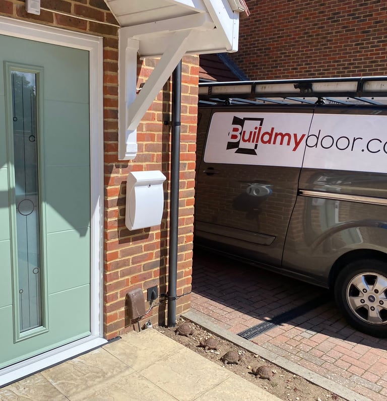 a chart well green front door with long glass panel and the buildmydoor van