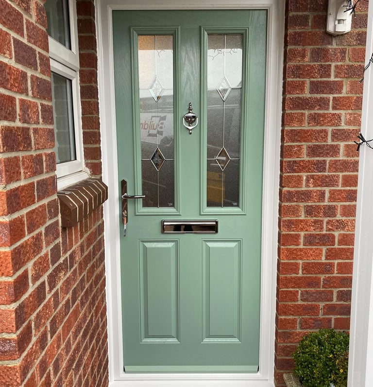 a new chartwell green l front door on red brick house installed by buildmydoor