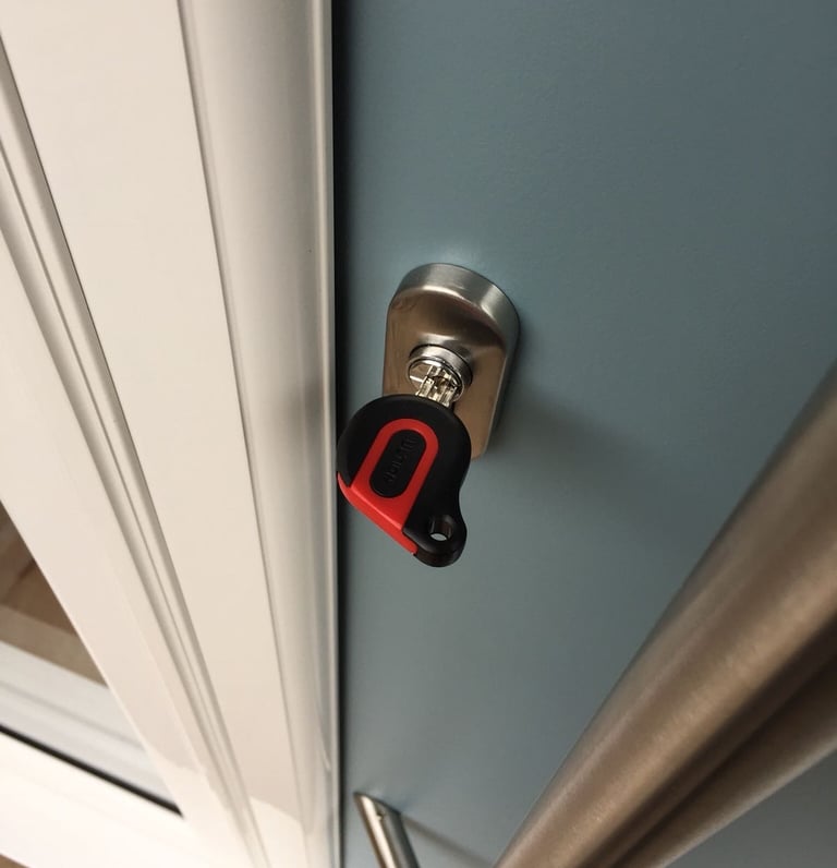 an ultion key on a new duck egg blue composite door