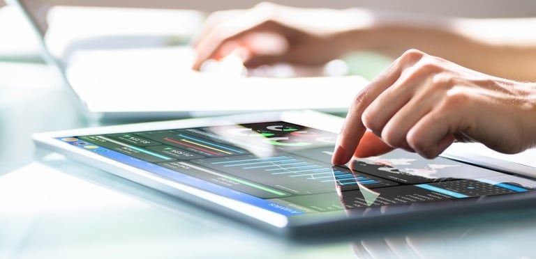 A woman working with a dashboard on a tablet