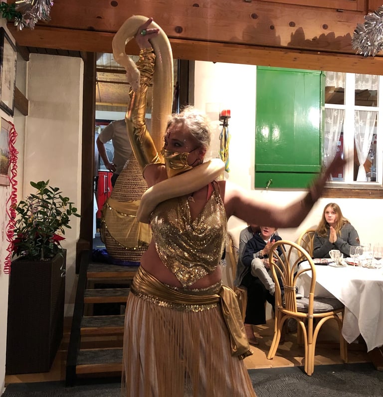 Snake charmer at hotel Lindenhof Brienz for the New Year's Eve Celebration