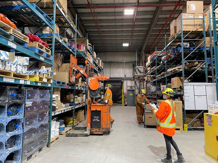  standing in a warehouse