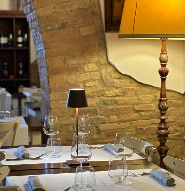 a table with a lamp and a lamp on it