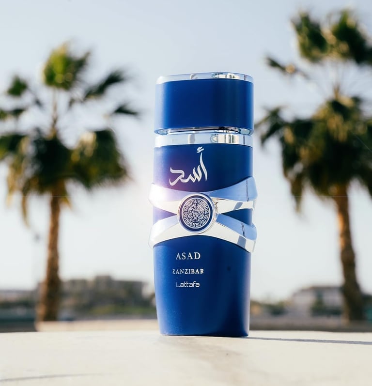 Lattafa Asad Zanzibar blue perfume bottle displayed outdoors with tropical palm trees.