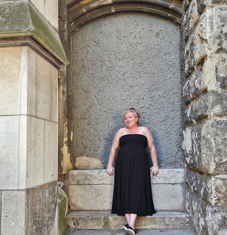 Amy  in her fun dress invites you to see how we can work together to make your work shine